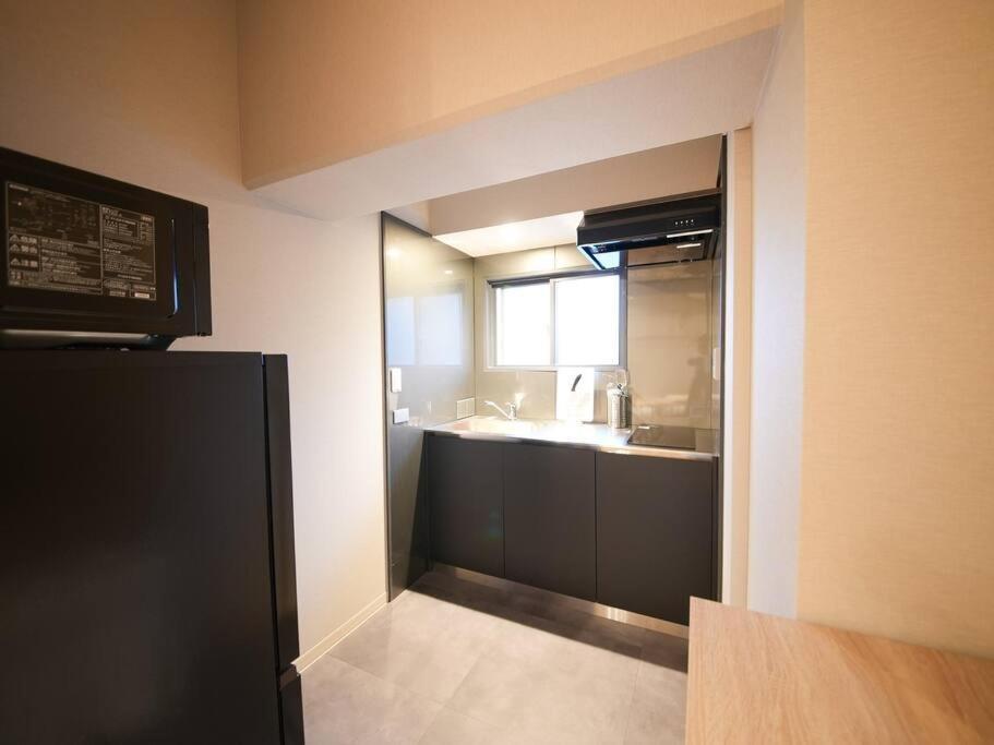 Apartment Tasoneurbanstayosaka なんば日本橋南不夜城709 Osaka